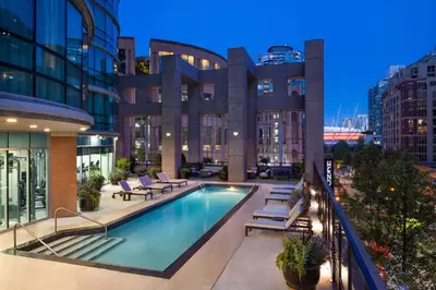 a swimming pool on the roof of a building at Hilton Vancouver Downtown, BC, Canada in Vancouver