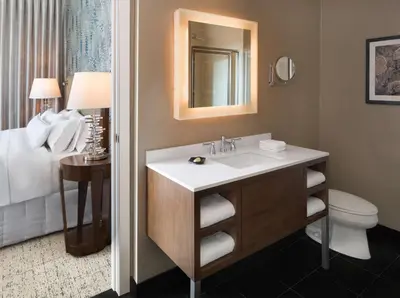 a bathroom with a sink and a toilet at Hilton Vancouver Downtown, BC, Canada in Vancouver