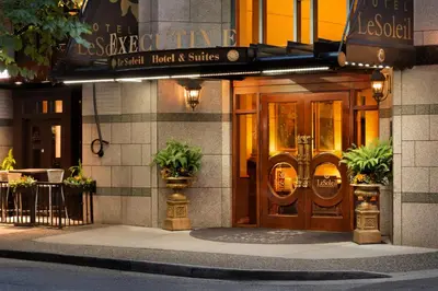 a front door of a building with plants in front at Hotel Le Soleil by Executive Hotels in Vancouver