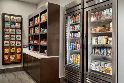 a kitchen with two large refrigerators at La Quinta Inn by Wyndham Vancouver Airport in Richmond