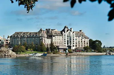 a large building on the shore of a body of water at Delta Hotels by Marriott Victoria Ocean Pointe Resort in Victoria
