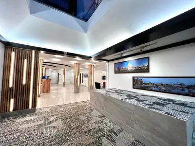 a living room with a large painting on the wall at The Vic, an Ascend Collection Hotel in Victoria