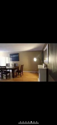 a kitchen and dining room with a table and chairs at YK Aurora in Yellowknife