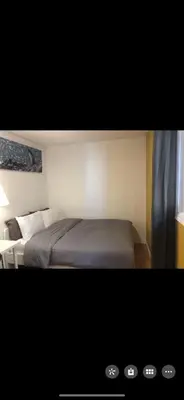 a hotel room with a bed and a window at YK Aurora in Yellowknife