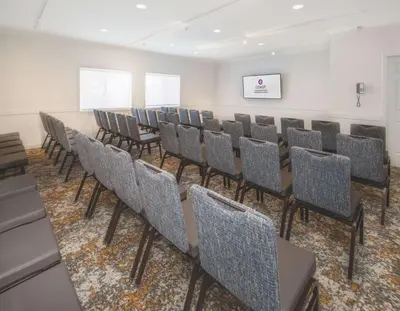 a row of chairs in a conference room at Coast Canmore Hotel & Conference Centre in Canmore