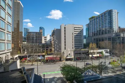 a view of a city with tall buildings at The Sutton Place Hotel Vancouver in Vancouver