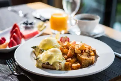 a plate of breakfast food with eggs and toast at Brentwood Bay Resort & Spa in Brentwood Bay