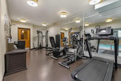 a gym with several treadmills and a treadmill at Best Western King George Inn & Suites in Surrey