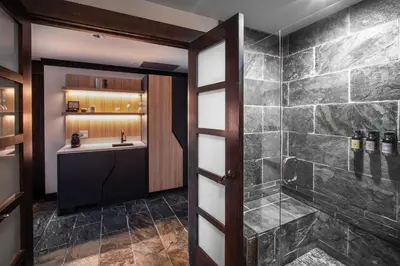 a bathroom with a shower and a sink at Nita Lake Lodge in Whistler