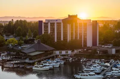 a group of boats docked in a marina at sunset at Radisson Blu Vancouver Airport Hotel & Marina in Richmond
