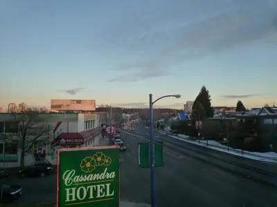 a sign for a hotel on a city street at Cassandra Hotel in Vancouver