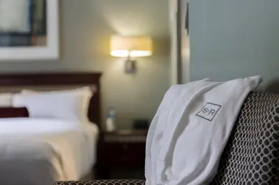 a pillow sitting on a chair in a hotel room at The St. Regis Hotel in Vancouver