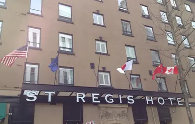 a hotel with a sign that reads st regis hotel at The St. Regis Hotel in Vancouver