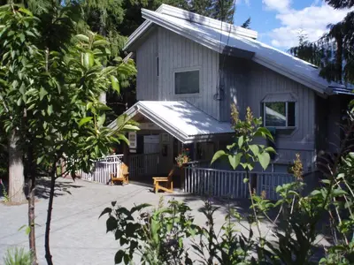 a house with a bench in front of it at Belle Neige Whistler in Whistler