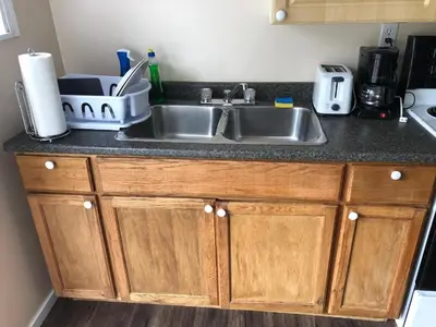 a kitchen with a sink and a counter top at Shady Willow Guest House - SMALL Indipendent Units with Seperate Entrance for Travellers in Chilliwack