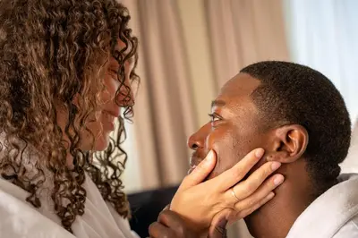 a woman looking at a mans face at Oswego Hotel in Victoria