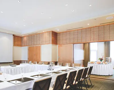 a large room with tables and chairs in it at Pan Pacific Whistler Village Centre in Whistler