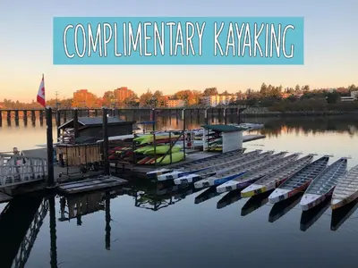 a group of boats docked at a dock in the water at Robin Hood Inn and Suites in Victoria