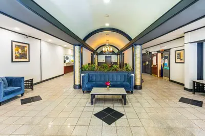 a lobby with blue couches and a coffee table at Comfort Inn & Suites in Edmonton