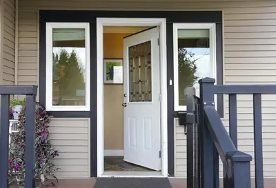 a white door on a house with a porch at Lovely J Home -Stunning river view cozy two bedroom private suite in New Westminster