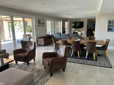 a living room with a table and chairs at Luxury accomodation in West Vancouver in West Vancouver