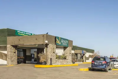 a car parked in front of a car dealership at Quality Hotel & Conference Centre in Fort McMurray