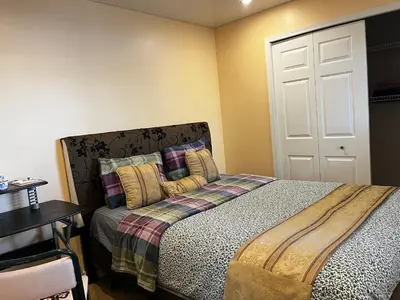 a bedroom with a bed and a white door at Citadel hill cr community! in Calgary