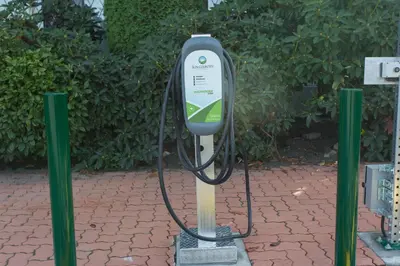 a charging station on a brick ground with two green poles at Abercorn Hotel, Trademark Collection by Wyndham in Richmond