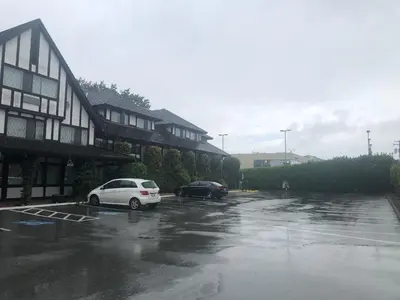 a car parked in a parking lot next to a building at Abercorn Hotel, Trademark Collection by Wyndham in Richmond