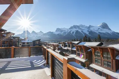 a view of the mountains from the balcony of a resort at Spring Creek Penthouse by Canadian Rockies Vacation Rentals in Canmore