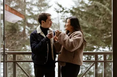 a man and a woman taking a picture with a cell phone at The Westin Resort & Spa, Whistler in Whistler