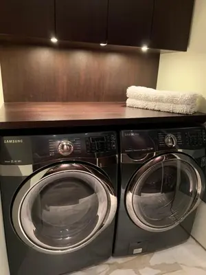 a kitchen with two washing machines and a counter at White House in Vancouver