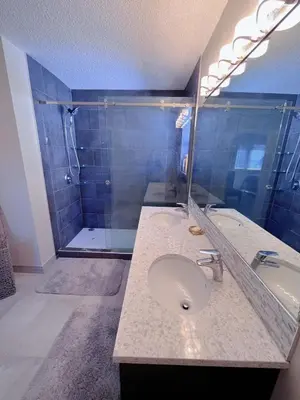 a bathroom with a sink and a shower at Banff -Calgary Garden &3 mins Bus station Close C-Train&Free Parking in Calgary