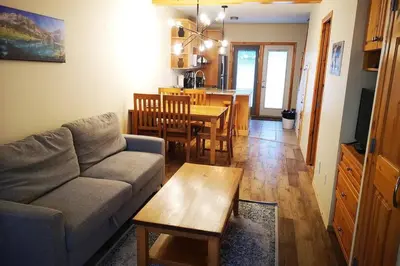a living room with a couch and a table at Banff Gate vacation townhouse in Canmore