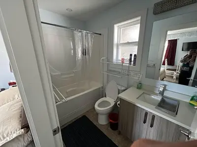 a bathroom with a sink and a toilet and a shower at Guest Suite Private Retreat for 2 Guests With AC - 4 Units Available in Abbotsford