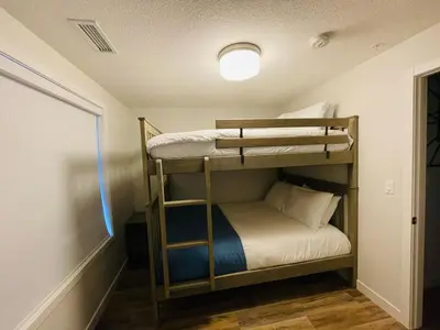 a bunk bed room with two bunk beds in it at Family Mountain Escape - Three Townhouses in One in Canmore
