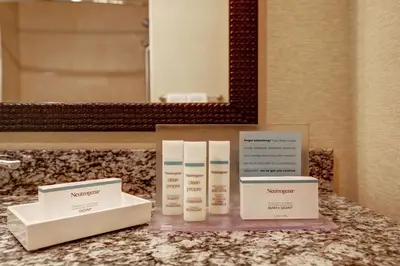 two boxes of makeup products on a counter in a bathroom at Hampton Inn by Hilton Chilliwack in Chilliwack
