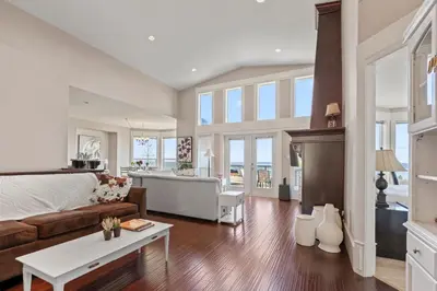 a living room with a couch and a table at Seaview Executive Home in Ladysmith