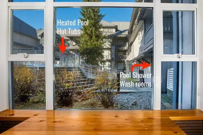 a glass door with a view of a stairwell at Luxury and Modern Studio at Blackcomb base in Whistler