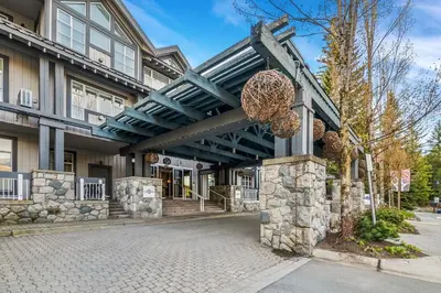 a building with a walkway in front of it at Luxury and Modern Studio at Blackcomb base in Whistler