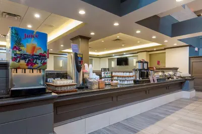 a food counter in a store with food on display at Best Western Plus Village Park Inn in Calgary