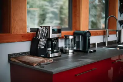 a kitchen counter with a coffee maker on it at Luxe Modern Timberframe - Iconic Panorama Views with AC in Nelson