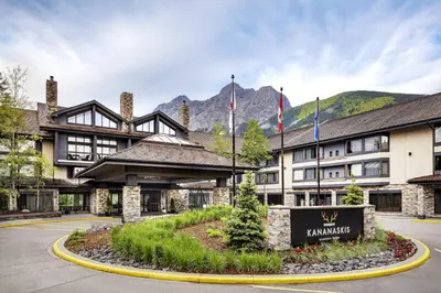 a hotel with a sign in front of a building at Kananaskis Mountain Lodge, Autograph Collection in Kananaskis Village