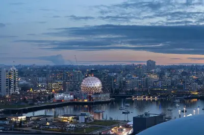 a view of a city at night with a ferris wheel at Beautiful Bright with water view AC DT 2BR 2BTh 3BD sleeps 6 guests in Vancouver