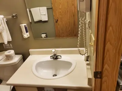 a bathroom with a sink and a toilet at Stars Inn - Motel in Fort Saskatchewan