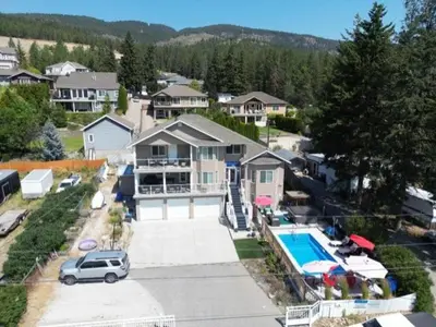 an aerial view of a house with a swimming pool at Salish B&B and Spa in West Kelowna