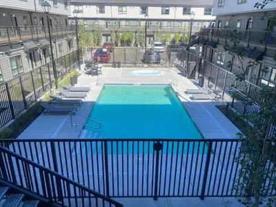 an overhead view of a swimming pool in a building at Skyline Getaway - Mountain Views - Pool - Hot Tub in Canmore