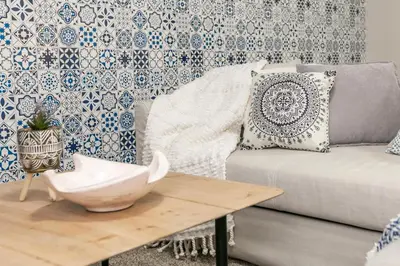 a living room with a couch and a table at Mediterranean Retreat - King Bed - Fireplace - Garage in Edmonton