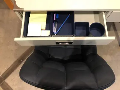 a desk with a black bean bag chair underneath it at Blanchard Mountain BnB in Canmore