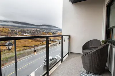 a balcony with a view of a car on the road at Vita Resort Vernon on Lake Okanagan in Vernon